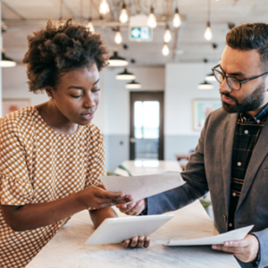 Man and Woman looking over papers