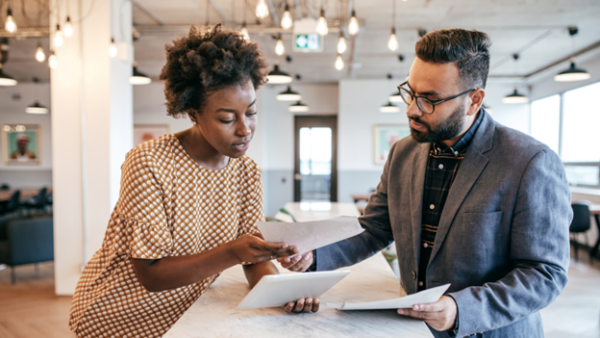 Man and Woman looking over papers