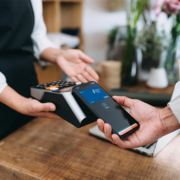 Close up of man paying with his phone