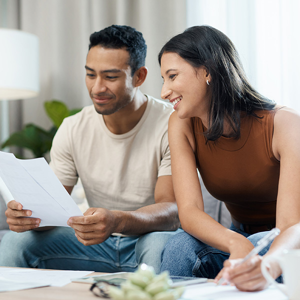 Couple reading letter received in the mail.